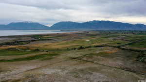 Property view of mountains with a water view