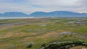 Property view of mountains with a water view