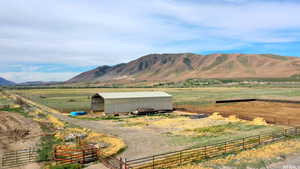 Property view of mountains with a rural view