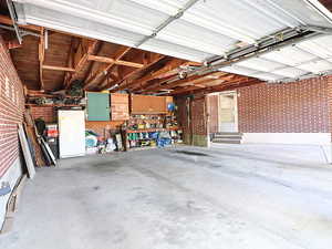 Garage featuring white fridge