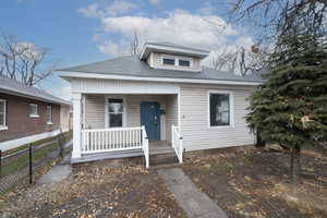 Bungalow featuring covered porch