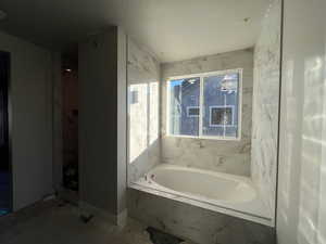 Bathroom with a relaxing tiled tub