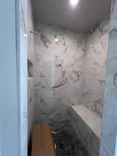 Bathroom featuring tiled shower