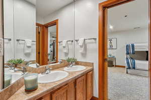 Bathroom with tile patterned flooring and vanity