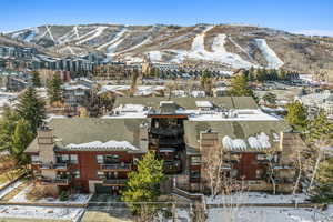 Snowy aerial view with a mountain view