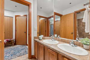 Bathroom with vanity and tile patterned floors