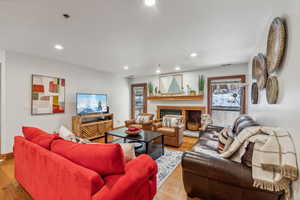 Living room with a wealth of natural light and light hardwood / wood-style flooring