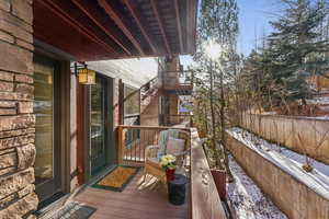 View of snow covered back of property