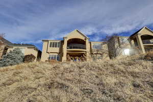 Rear view of house featuring a balcony