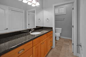 Bathroom with vanity and toilet