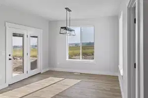 Unfurnished dining area with light hardwood / wood-style flooring