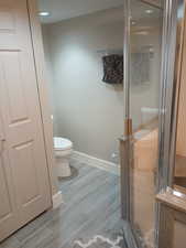 Bathroom featuring toilet and walk in shower