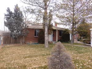 View of front of property with a front lawn