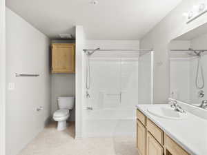 Full bathroom featuring shower / tub combination, vanity, and toilet