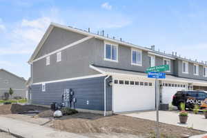 View of front facade featuring a garage