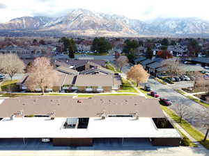 Birds eye view of property with a mountain view