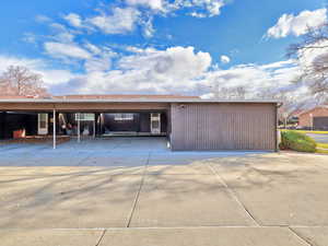 Garage featuring a carport