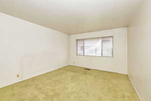 Unfurnished room featuring carpet