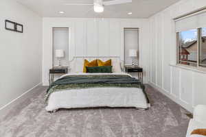 Carpeted bedroom with ceiling fan