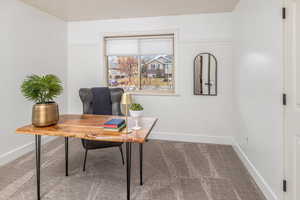 View of carpeted home office