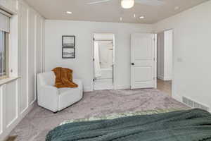 Sitting room with light carpet and ceiling fan