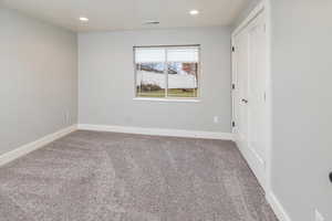 Spare room with carpet floors