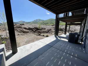 View of patio with a mountain view
