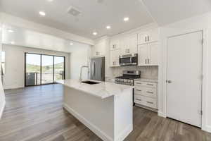 A kitchen that actually makes cooking fun-quartz counters, stainless steel, and space for everything.