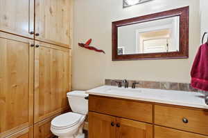 Bathroom featuring vanity and toilet