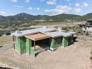 View of subject property with a mountainous background