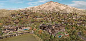 Aerial view of property's location with a mountain backdrop