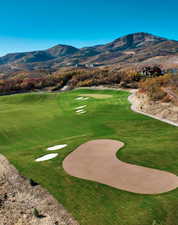 View of community featuring a mountain view and view of golf course