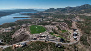 View of property location featuring a water and mountain view