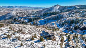 Snowy aerial view featuring a mountain view