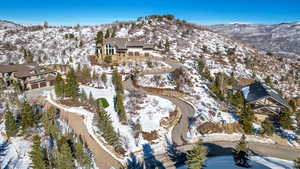 Snowy aerial view featuring a mountain view