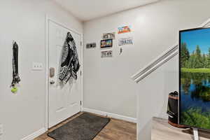 Entrance foyer with light wood-type flooring