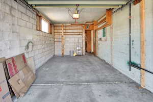 Garage w/automatic garage door opener and storage shelves