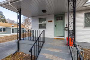 Property entrance featuring covered porch