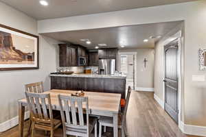 Dining room with light hardwood / wood-style floors