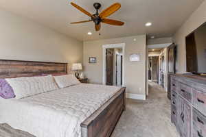 Bedroom featuring ceiling fan and light carpet