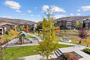 Exterior space with a playground, a mountain view from the balcony