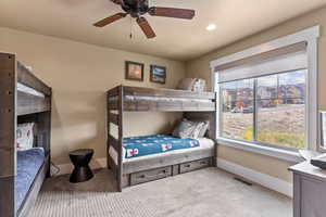 Bedroom with carpet flooring and ceiling fan