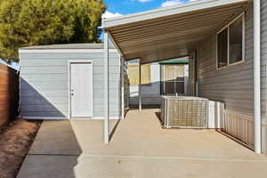 View of patio with central AC and heating