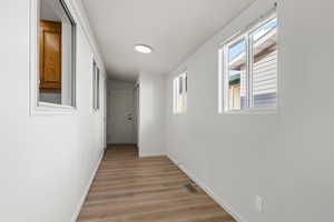 Bedroom featuring a healthy amount of sunlight and vinyl plank flooring