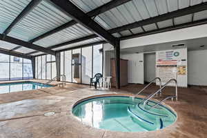 View of pool and hot tub