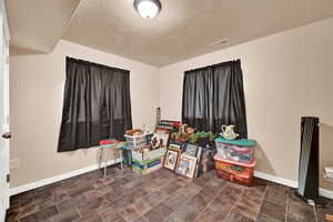 Misc room featuring a textured ceiling