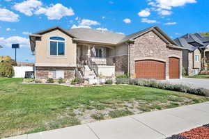 View of front of house featuring a front lawn