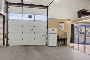 Garage with white refrigerator