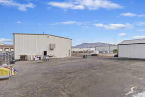 View of outbuilding featuring a mountain view