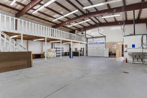 Garage with white refrigerator